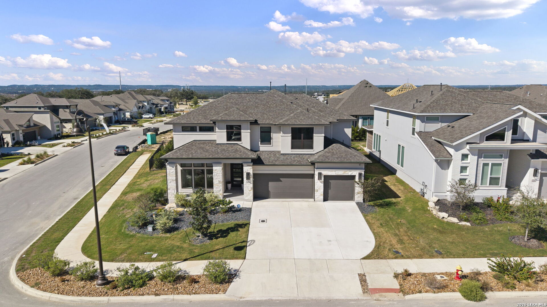 402 Fandango Boerne TX island kitchen gas cooking fireplace high ceilings three living areas Perry Homes Esperanza interior