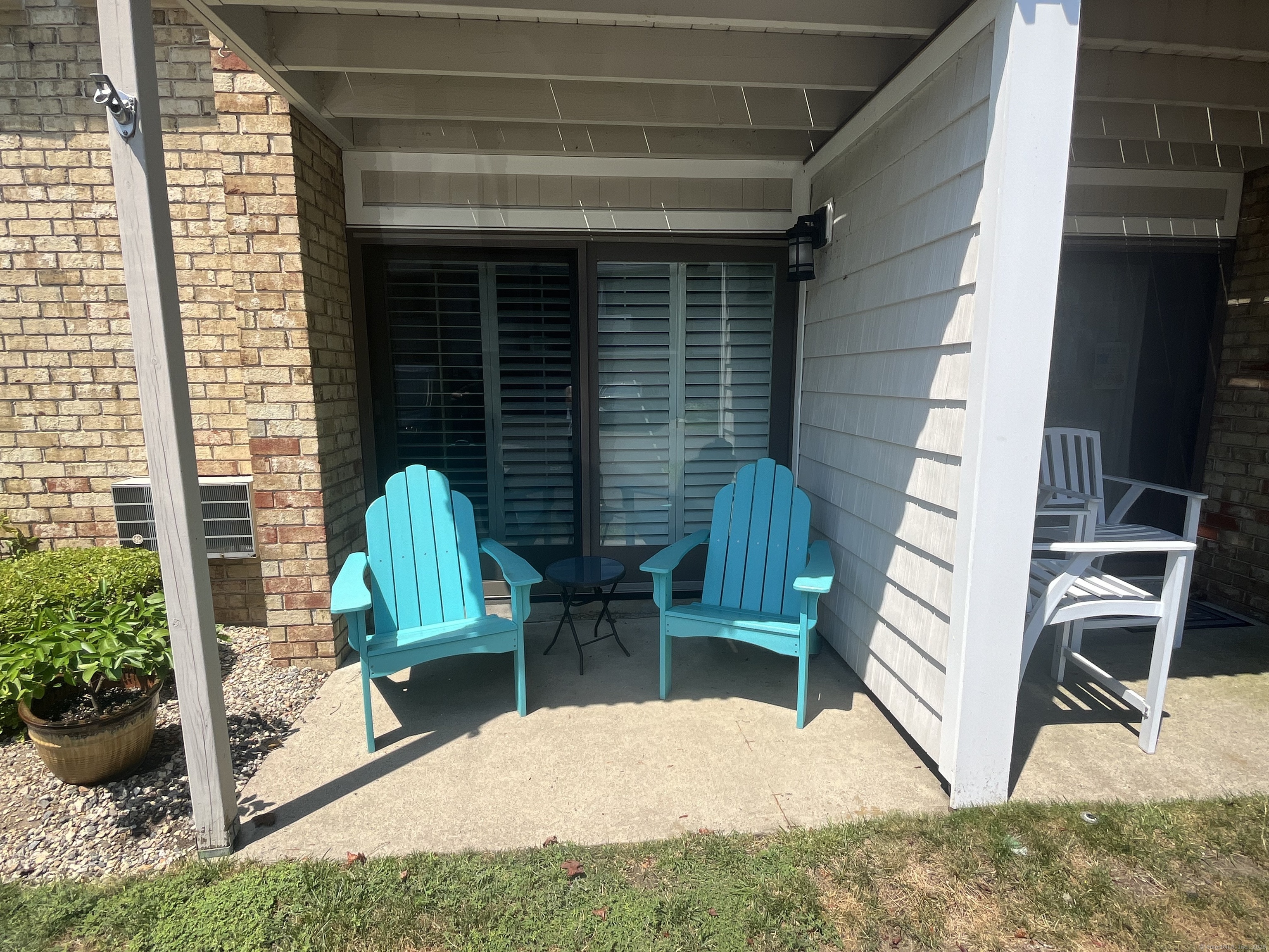 Private patio with Adirondack chairs